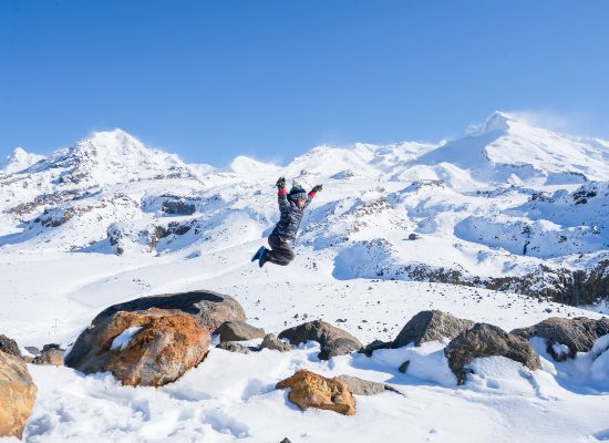 Kid Jumping in the Snow